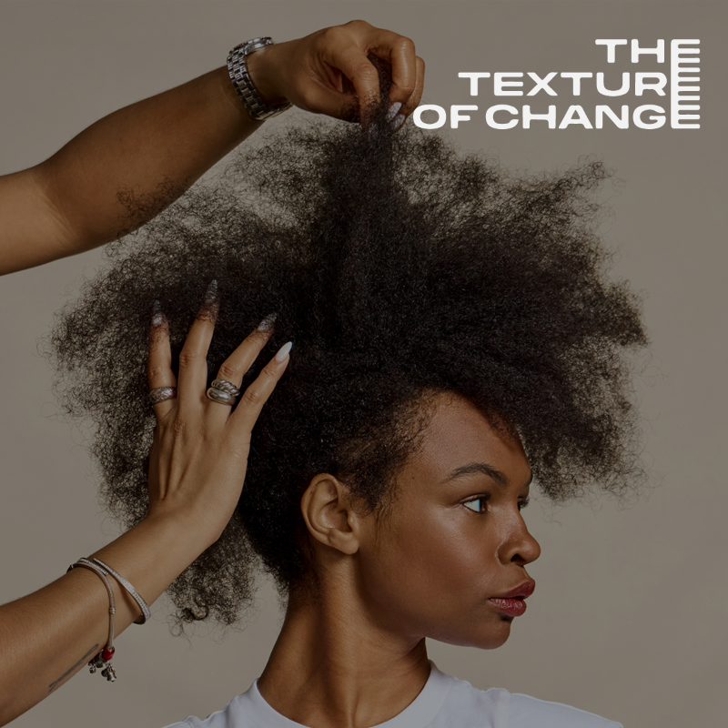 Hands styling textured hair with the caption "THE TEXTURE OF CHANGE" in the top right corner.